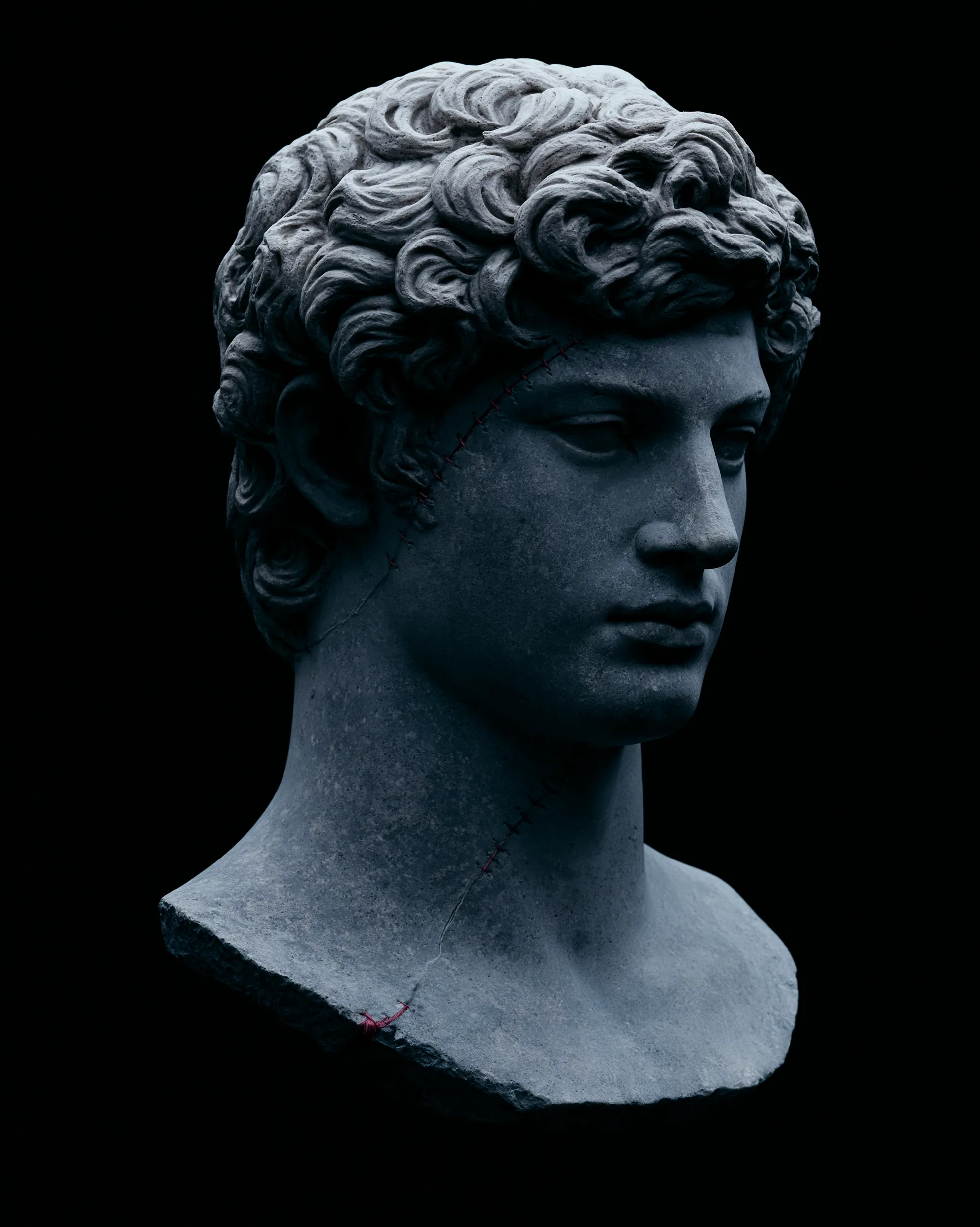 WOUNDED design — a cracked marble bust with the word WOUNDED torn behind it. JAUNE 1/1, sold out.