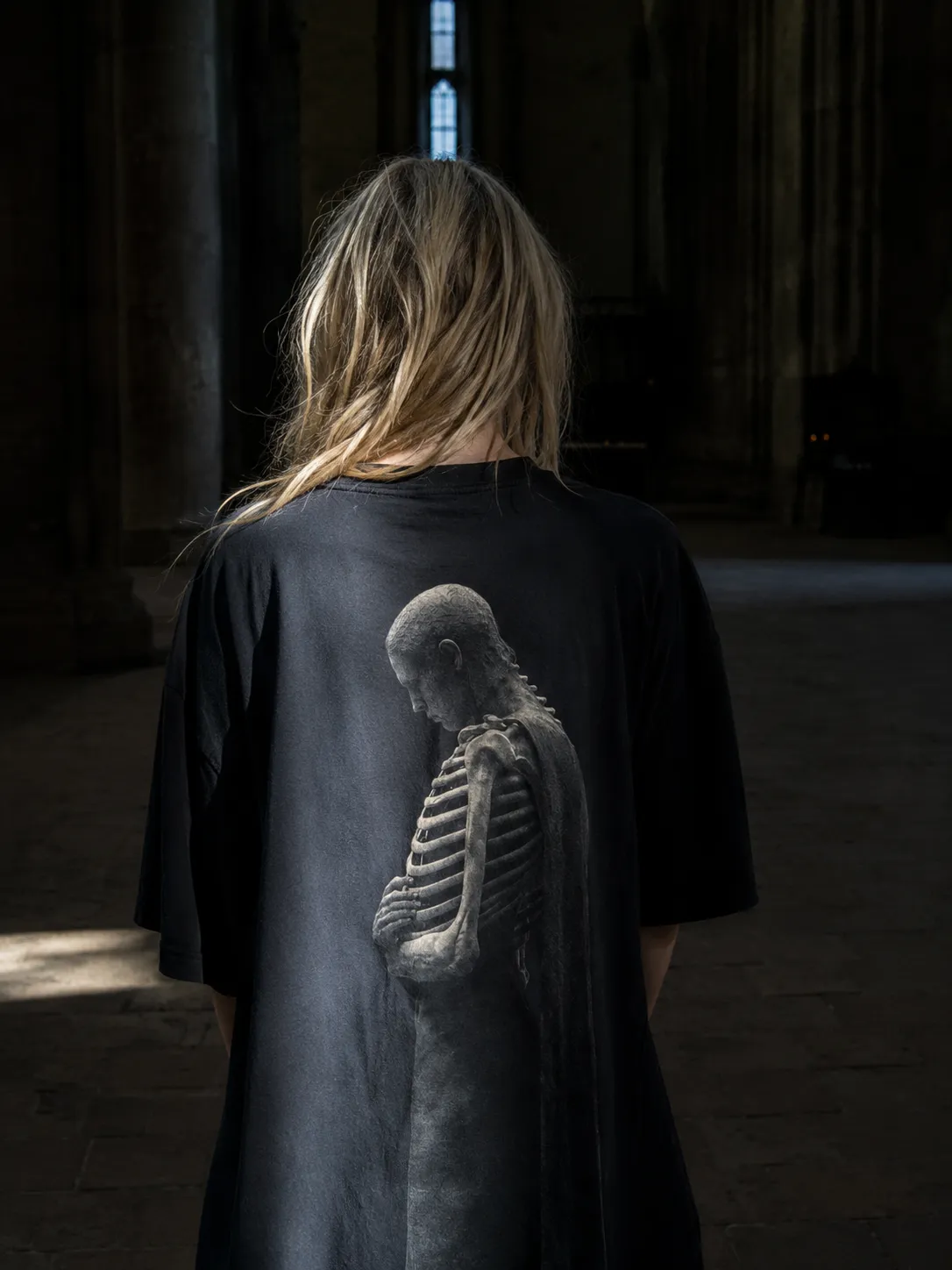 The HOLLOW tee worn, the print large across the back.
